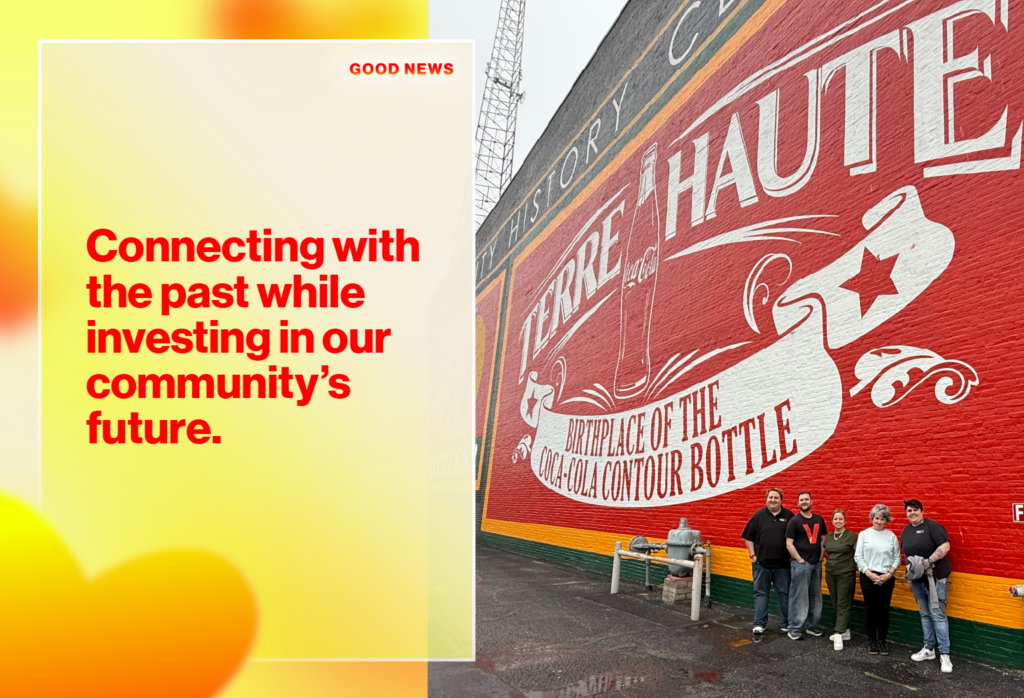 Hero announces good news: bold red headline on yellow panel reading 'Connecting with the past while investing in our community's future.' with a mural backdrop and small 'GOOD NEWS' label at top right.