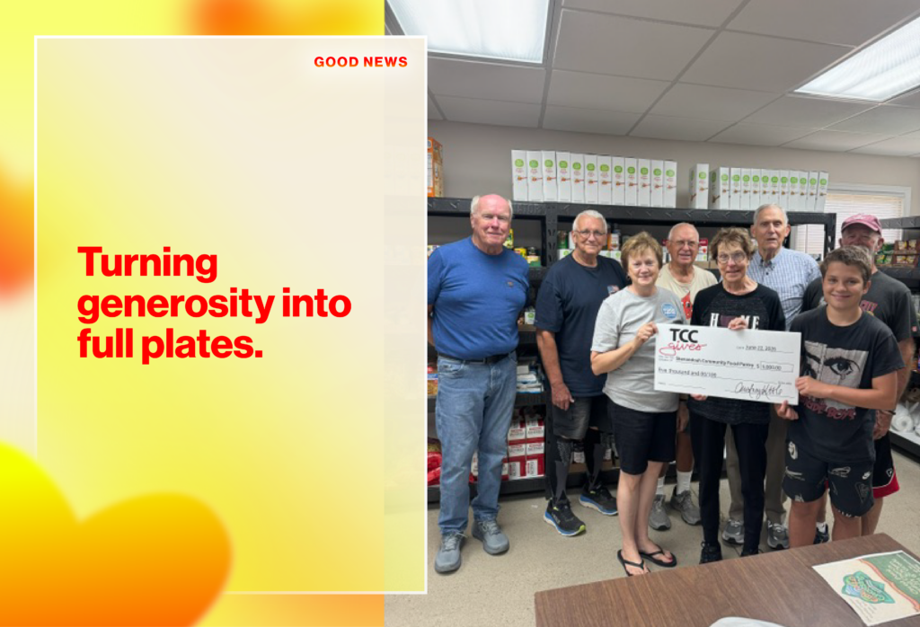 Group of volunteers in a food pantry posing with a large donation check, with a colorful graphic reading 'Turning generosity into full plates' on the left side.
